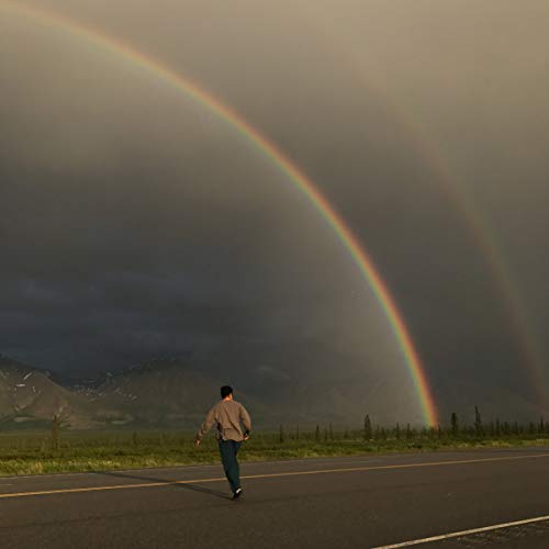 CD cover with a person walking towards a double rainbow.