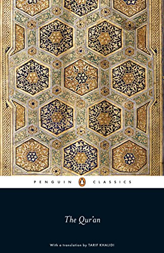 Book cover of "The Qur'an" featuring intricate gold and teal Islamic patterns.