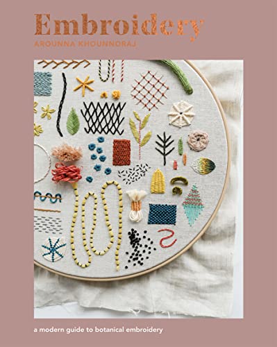 Book cover featuring colorful botanical embroidery designs on fabric.