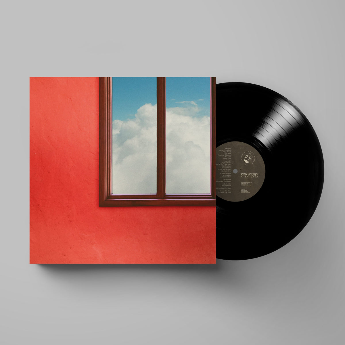 Khruangbin's "A La Sala" vinyl record with a window and sky cover.