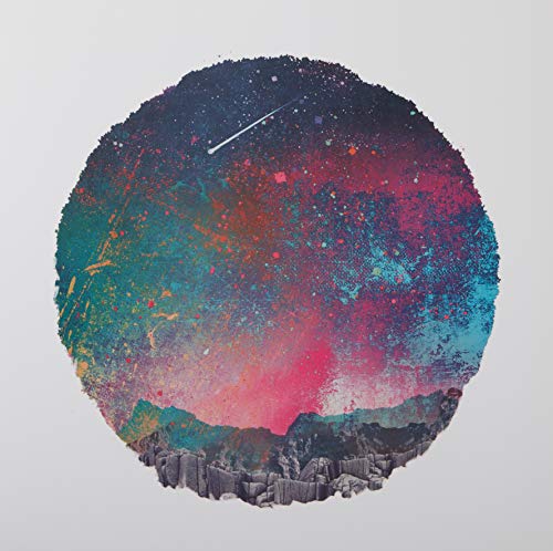 Circular artwork showing a colorful, textured night sky over a rocky mountain landscape.