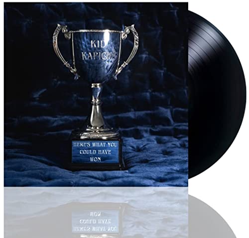 Kid Kapichi album cover featuring a gold trophy on blue velvet.