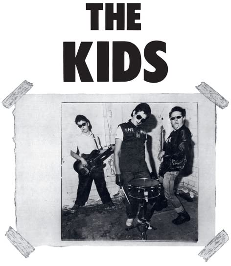 Black and white photo of a three-piece punk rock band.