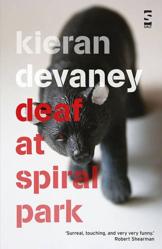 Book cover featuring a small black bear figurine and text title Deaf at Spiral Park.