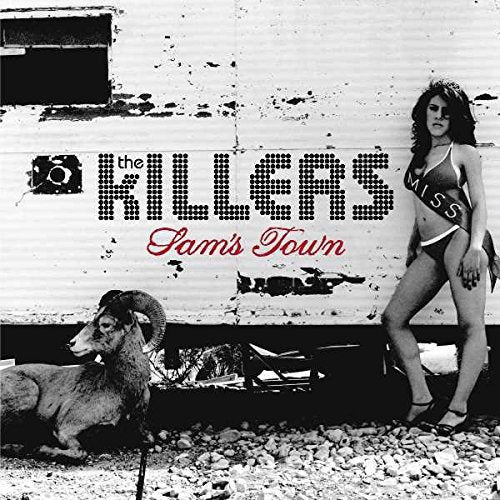 The Killers’ “Sam’s Town” CD cover with a woman, ram, and trailer.