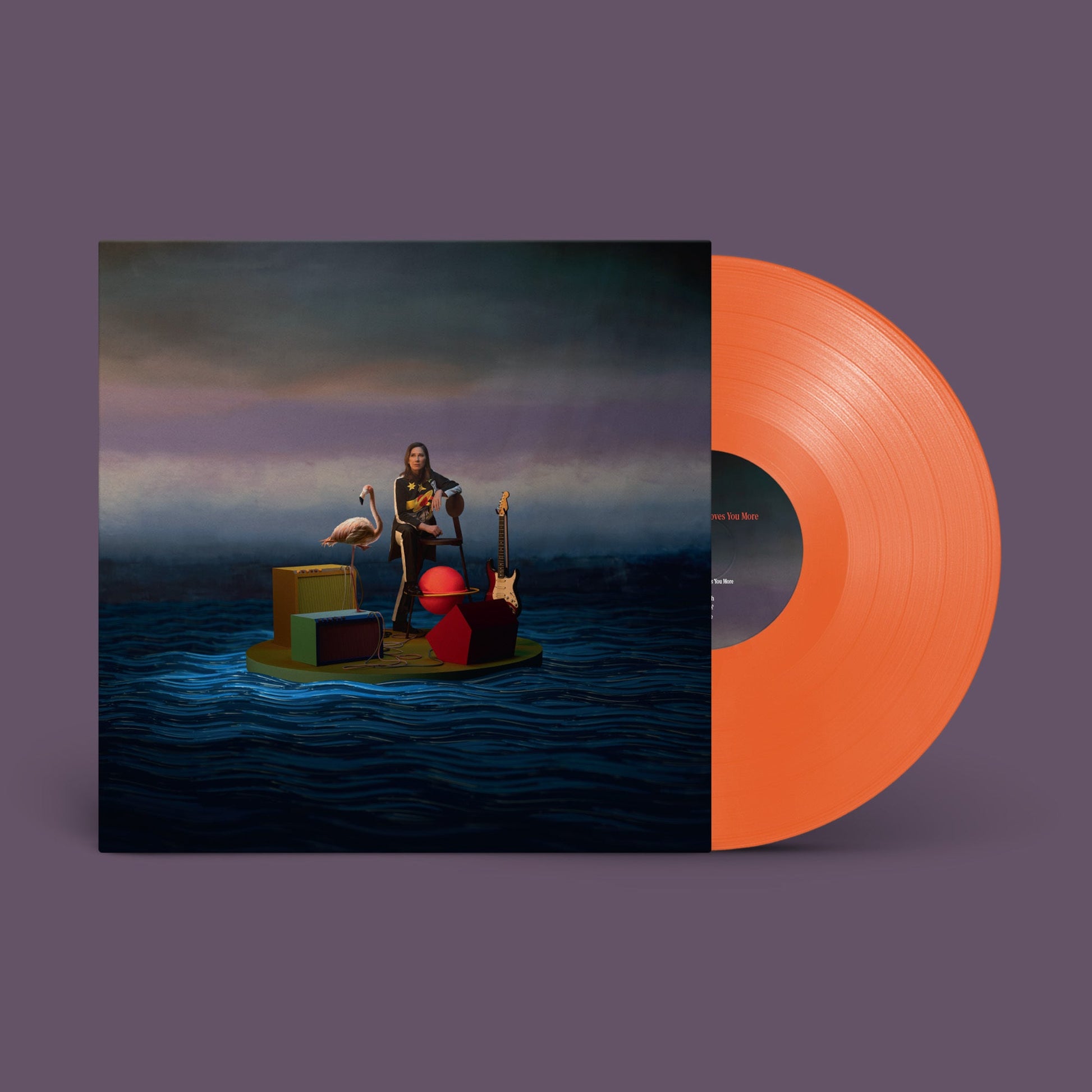 Kim Deal album cover featuring a person on a raft with an orange vinyl.