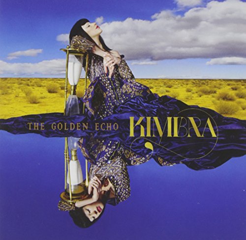 Kimbra album cover, woman in landscape with hourglass reflection.