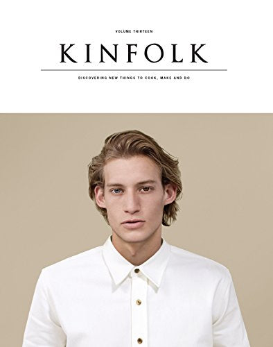 Kinfolk magazine cover, Volume 13, featuring a young man in white.