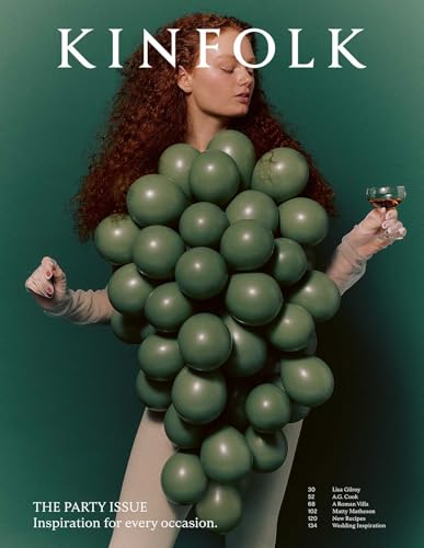 Kinfolk magazine cover featuring a woman with green spheres and a wine glass.