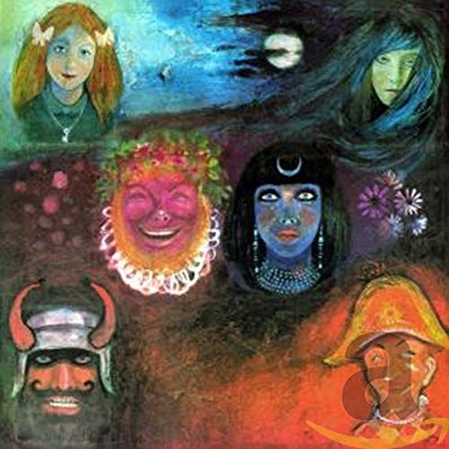 Album cover with painted faces and surreal, colorful imagery.