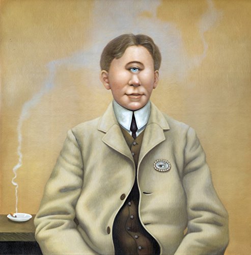A man in a beige jacket with an eye emblem on the lapel.