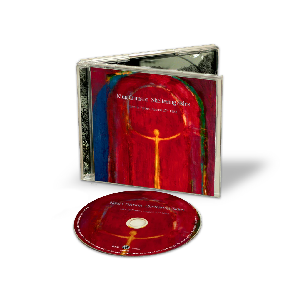 King Crimson "Sheltering Skies" CD case, red and blue abstract cover art.