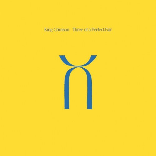 Yellow CD cover with blue abstract symbol and "King Crimson Three of a Perfect Pair."