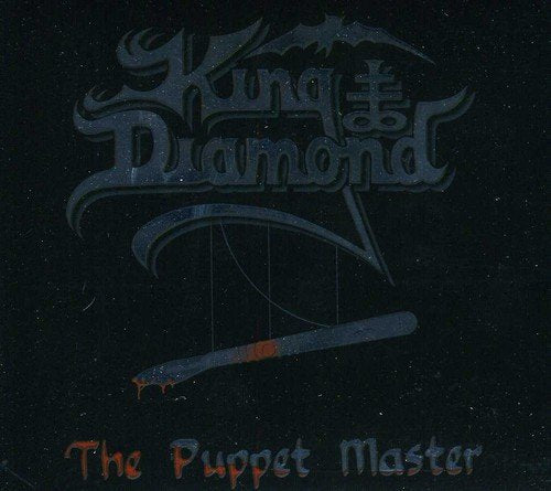 "Album cover with silver text 'King Diamond' and a bloody pen on black background."
