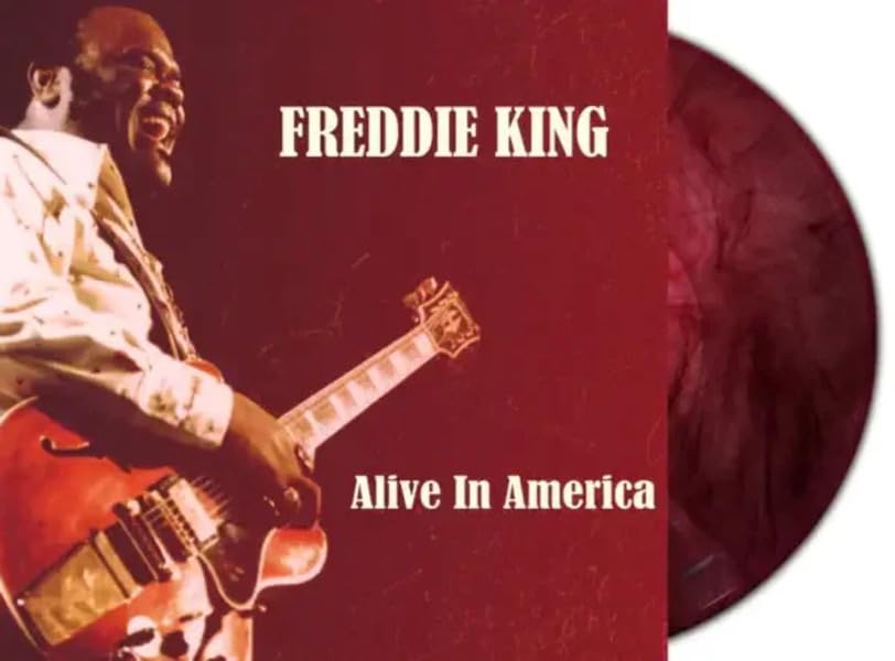 Freddie King album cover with red marbled vinyl record shown beside it.