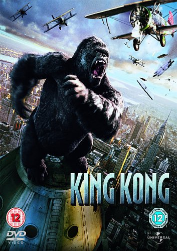 King Kong roars atop a building, surrounded by vintage airplanes.