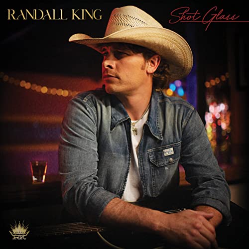 Randall King album cover, man in cowboy hat with guitar.