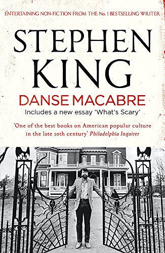 Book cover for Danse Macabre by Stephen King featuring a man standing before gates.