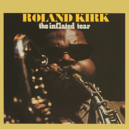 Roland Kirk playing saxophone, album cover for "Inflated Tear".
