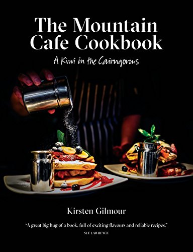 Cookbook cover showing powdered sugar being dusted over stacked pancakes with fresh berries.