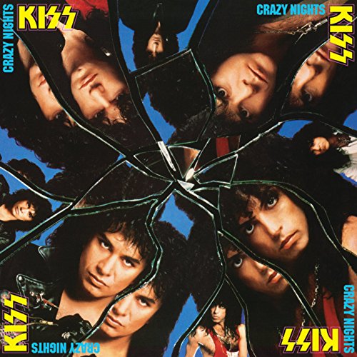 Kiss band members’ faces reflected in shattered glass on album cover.