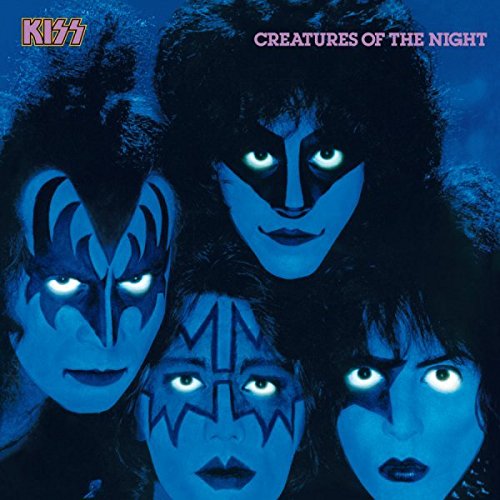 Kiss band members with blue and black makeup on album cover.