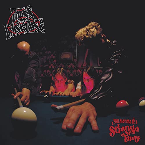 CD cover with figures around a pool table in a dimly lit room.