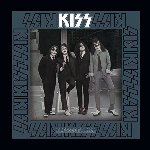 Kiss band members in suits on album cover, "Dressed to Kill".