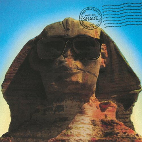 Sphinx with sunglasses on a blue postage stamp background.