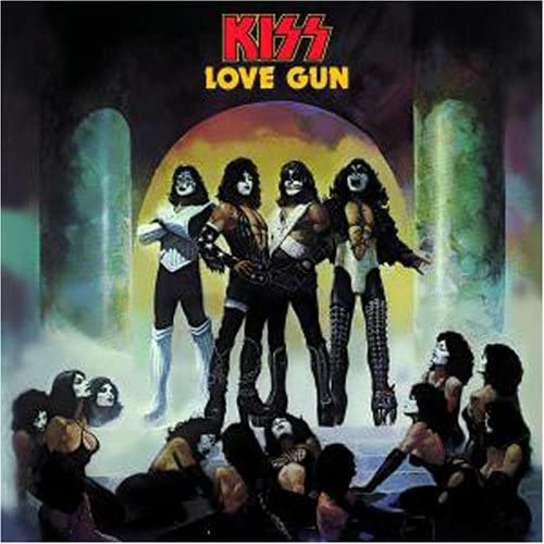 Kiss band members in makeup, posing dramatically on the Love Gun album cover.