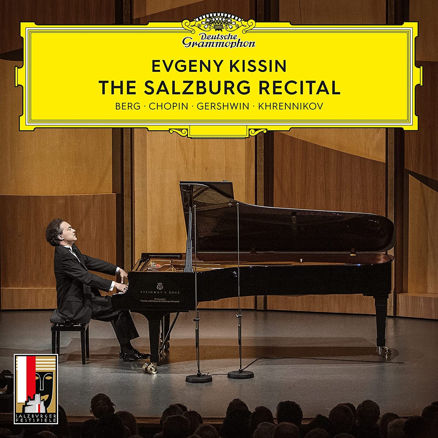 Evgeny Kissin at a grand piano on stage, album cover art.