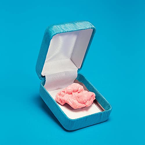 A piece of pink chewing gum inside an open blue jewelry box.