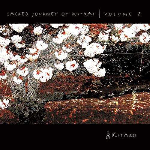 Kitaro album cover: blossoming tree branches against a dark, textured background.
