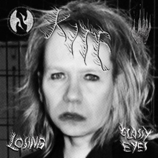 Black and white album cover featuring a person’s face with moth imagery.