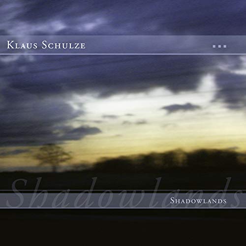 Album cover for Klaus Schulze’s “Shadowlands” with a cloudy, sunset landscape.