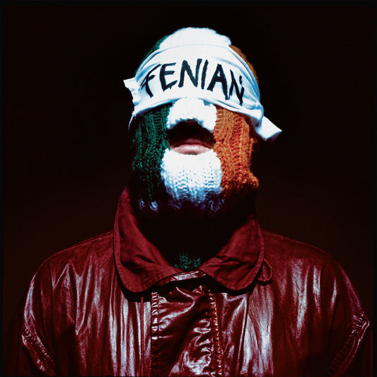 Person with Irish flag colors painted on face, wearing a headband.