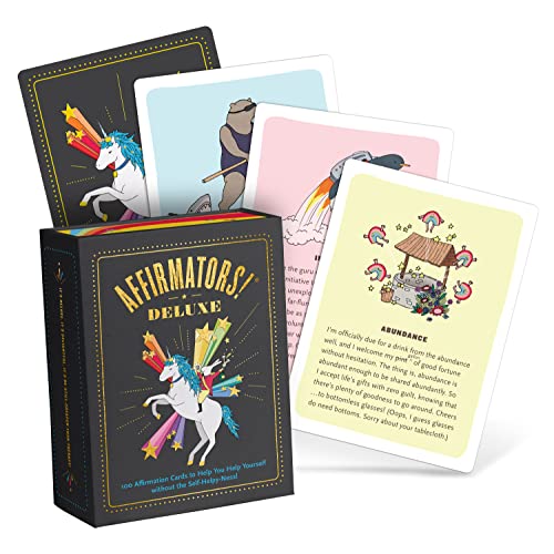 Box of affirmation cards with colorful illustrations of unicorns and other images.