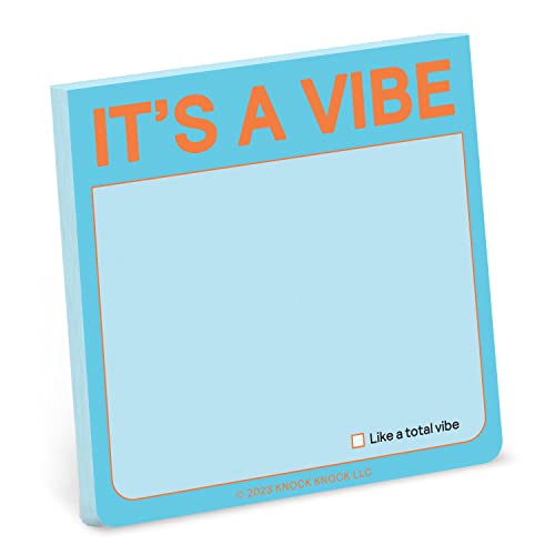 Light blue sticky note pad with orange text reading "IT'S A VIBE".