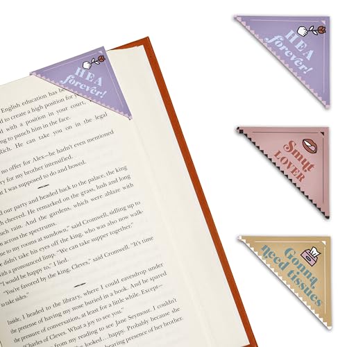 Four corner bookmarks with romantic phrases layered on an open book.