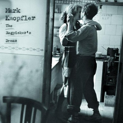Black and white photo of a couple embracing, album cover visible.