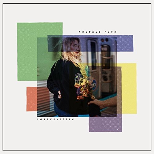 The alt text for the image is: "Album cover with a woman holding flowers, layered with colored rectangles."