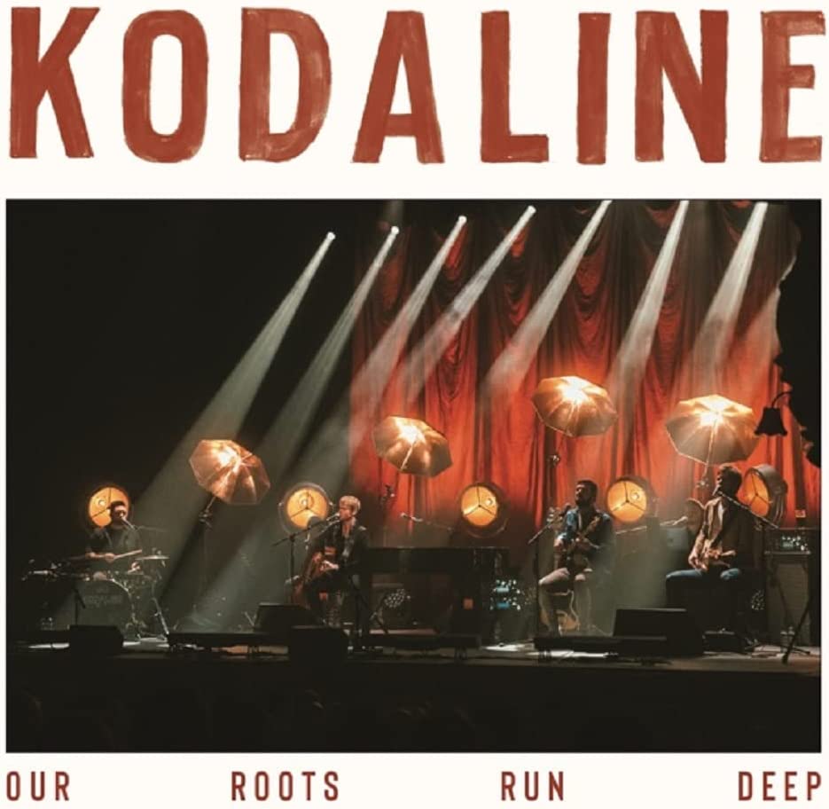 Kodaline album cover, band performing onstage with hanging umbrellas.