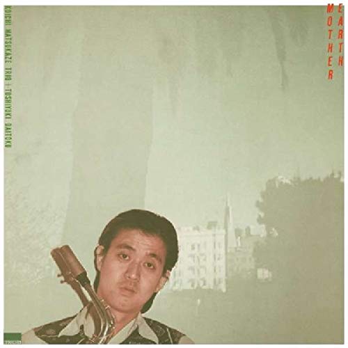 A man holding a saxophone against a pale, hazy background with building silhouettes.
