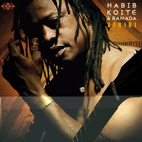 Album cover featuring a man with dreadlocks, wearing a black top, against a brown background.