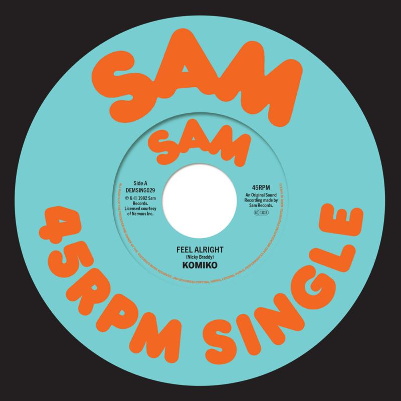 Vinyl record label with red text on a teal and white background.