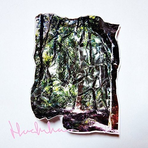 A vinyl record sleeve with a forest image and pink signature on a white background.