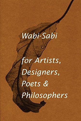 Book with brown cover and Japanese-inspired design, featuring wabi-sabi theme and philosophical text.