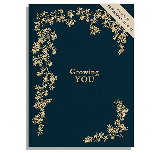 Dark blue pregnancy journal, “Growing You” in gold lettering, with gold foliage.