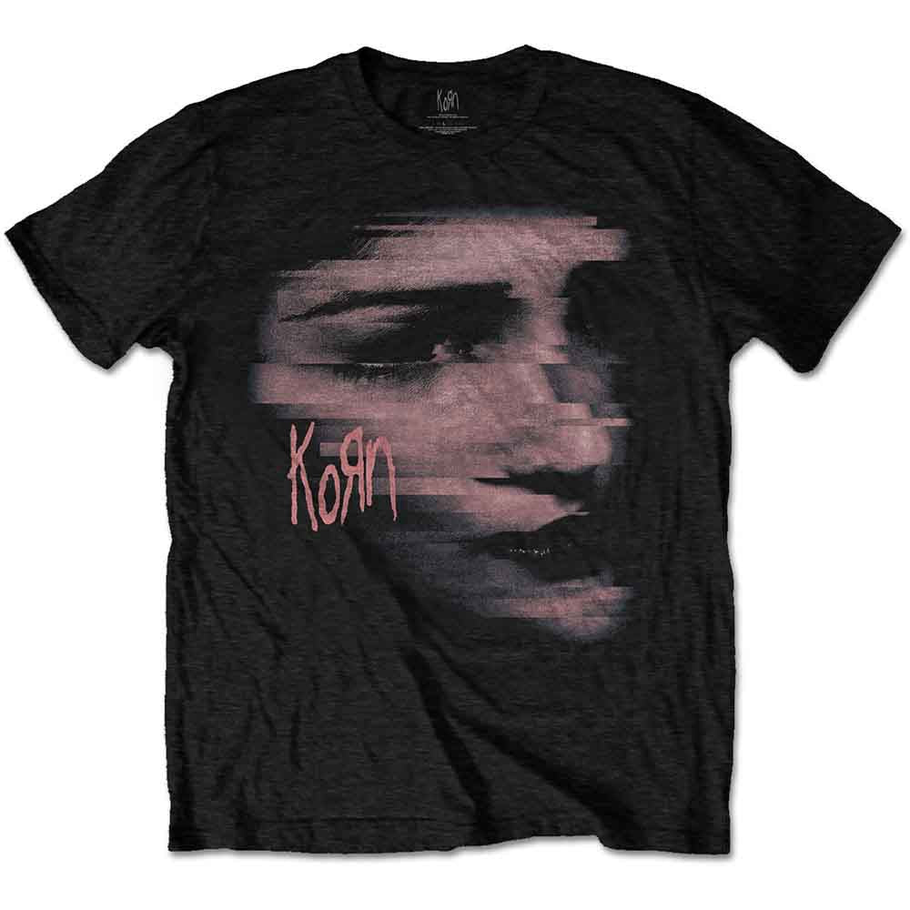 A man wears a black Korn t-shirt featuring a distorted, chopped face graphic.