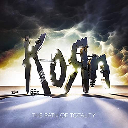 Korn album cover: large, metallic band name against a stormy sky.